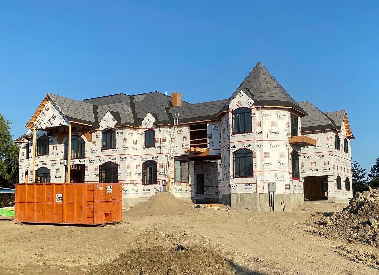 Large custom estate residence during exterior envelope construction